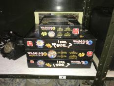 A quantity of Wasgij jigsaw puzzles + 1 other.