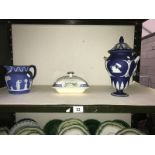 A Wedgwood blue jasper ware urn, a jug and an M Forester 1925 Henley tureen.