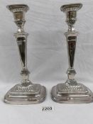 A pair of Victorian Sheffield plate candlesticks.