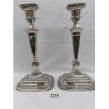 A pair of Victorian Sheffield plate candlesticks.