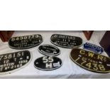 7 cast iron railway wagon plaques.