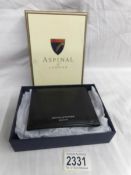 A boxed Aspinal of London leather wallet.