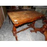 A Victorian fold over table on stretcher base (has worm in base).