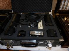 A cased Pentax Asawi Sportmatic 35mm camera and various lenses.