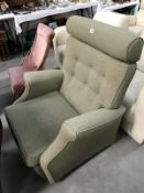 A green fabric arm chair.