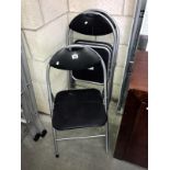 3 folding tubular metal chairs.