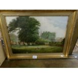 A gilt framed oil on canvas rural scene with sheep.