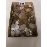 A mixed lot of UK and foreign coins.