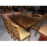 An oak dining table with 6 chairs.