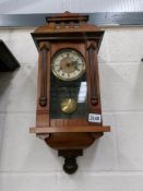 A small Victorian mahogany 8 day wall clock, in working order.