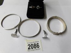 3 silver bracelets, cuff links and 2 rings.