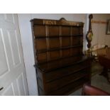 A dark wood dresser with Fortnum and Mason signage.