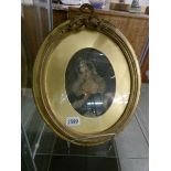 A 19th century gilt framed and glazed oval watercolour portrait of a lady,