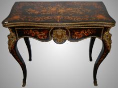 An exceptional 19th century French ebony and marquetry card table.