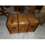 A large old cabin trunk.