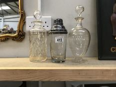 2 vintage decanters and a cocktail shaker.