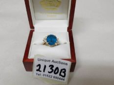 An 18ct gold ring set topaz and diamonds, size M.