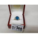 An 18ct gold ring set topaz and diamonds, size M.