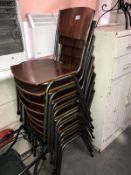 A set of 8 retro style stackable chairs.