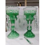 A pair of Victorian green glass lustre's, some droppers a/f.