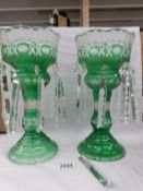 A pair of Victorian green glass lustre's, some droppers a/f.