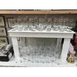 A large quantity of advertising glasses including Grolsch, Stella Artois, Gayner's Cider etc.
