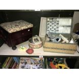 A vintage wicker sewing basket and contents, tin of buttons, work stool etc.