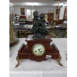 A French marble clock surmounted 2 children, (cracks to marble).