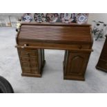 An oak roll top desk.