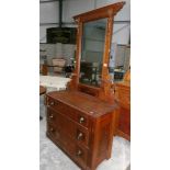 A stained pine dressing table.