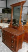 A stained pine dressing table.