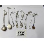 8 assorted silver lockets and pendants all on silver chains.