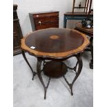 A mahogany inlaid occasional table.