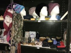 2 shelves of miscellaneous items, including belts, purses, scarves,