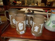 4 19th century stone ware jugs with applied decoration.