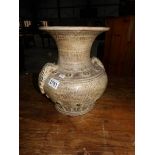 A Grecian urn style vase.