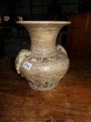 A Grecian urn style vase.