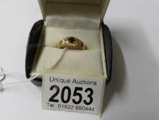 An 18ct gold ring set sapphire and 2 diamonds, size S.