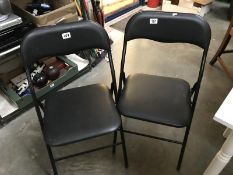 2 folding chairs.