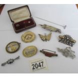 A mixed lot of vintage brooches including carved examples.