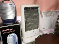 A dehumidifier, a halogen heater and one other heater.