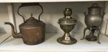 A Victorian copper kettle, oil lamp and pewter samovar.