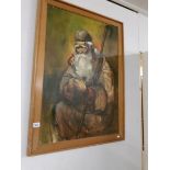 A large oil on canvas of an elderly bearded gentleman, signed but indistinct.