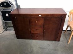 A dark wood 2 door, 3 drawer sideboard.