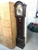 A contemporary Grandmother clock with weights and pendulum.