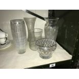 A cut glass vase and other glass vases.