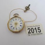 A 19th century ladies 9ct gold fob watch in working order but missing glass.