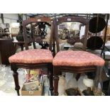 A pair of mahogany bedroom chairs