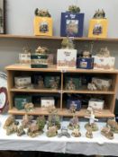 A large quantity of boxed and unboxed Lilliput lane cottages and an ornamental set of bagpipes.
