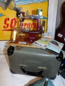 A boxed Essex miniature sewing machine, in excellent condition and possibly never used.